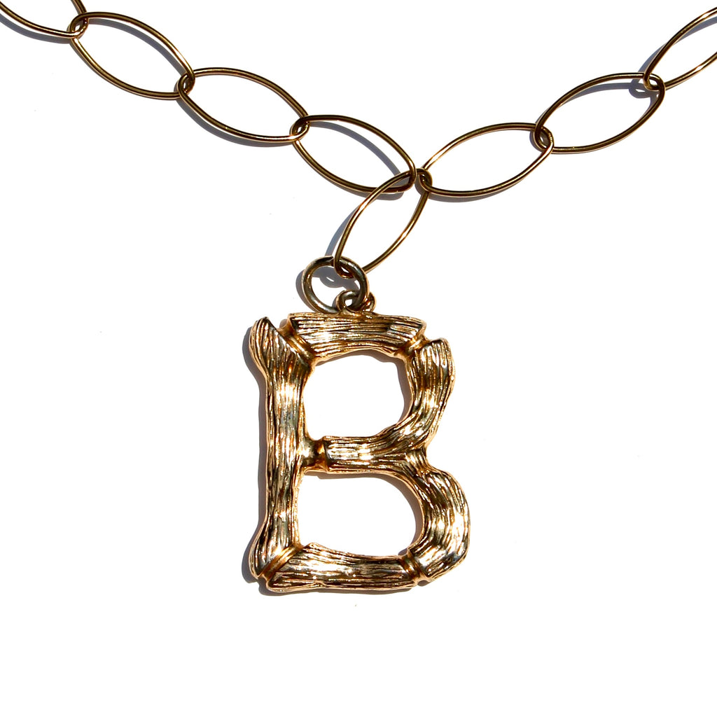 THE INITIAL NECKLACE